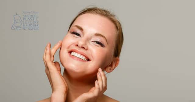 Model image of a mature woman smiling with her hands on her face