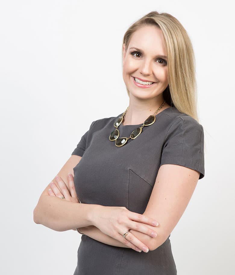 Brandie posing with arms crossed and smiling