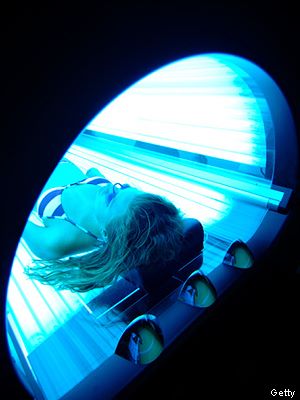 woman laying in tanning bed