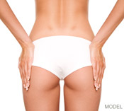 woman's buttocks in white underwear