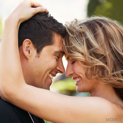 Do Women With Breast Implants Have Better Sex Lives? couple smiling
