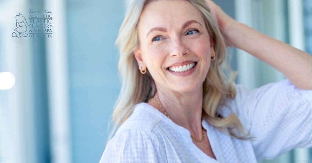A woman smiling with her hands on her head (MODEL) Kent V. Hasen, MD Logo