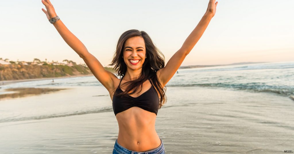Woman happy with her tummy tuck.