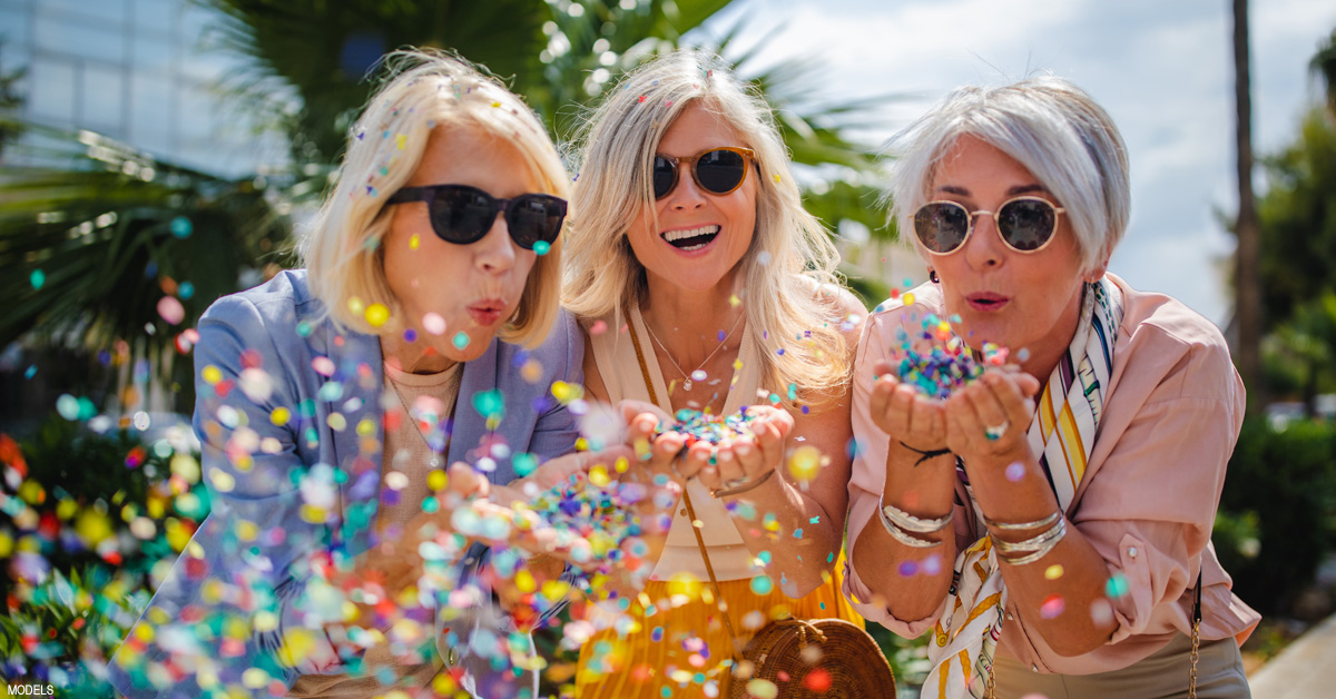 Mature woman with friends after facelift recovery