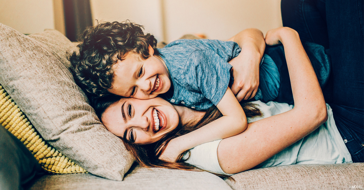 Happy mother and child laughing