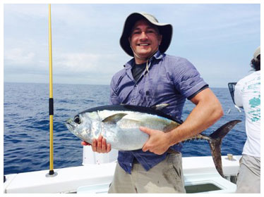 Dr. Hasen holding fish