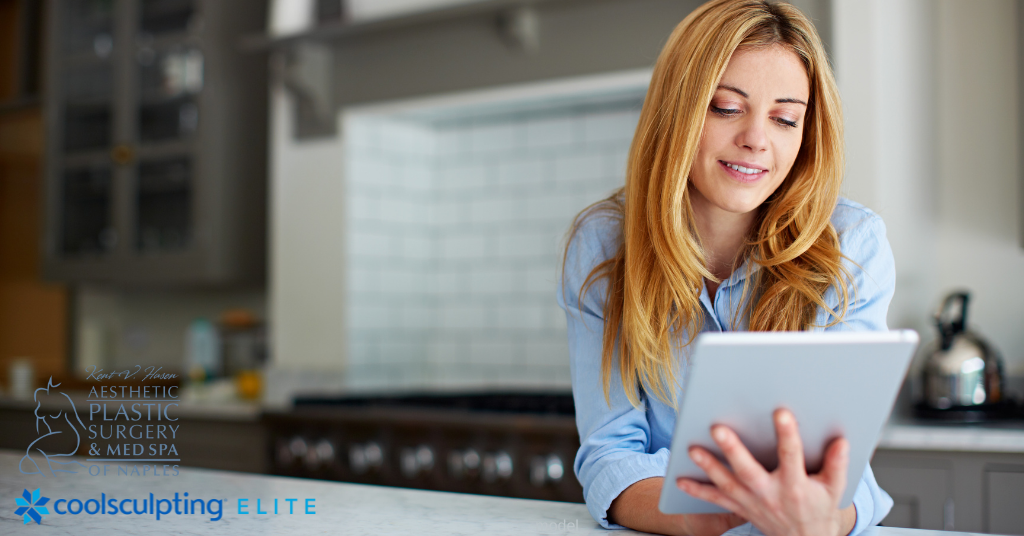 Woman reading about CoolSculpting Elite