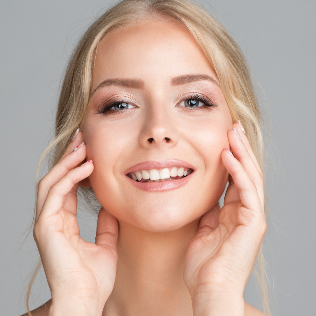 Women touching face after chemical peel (model)