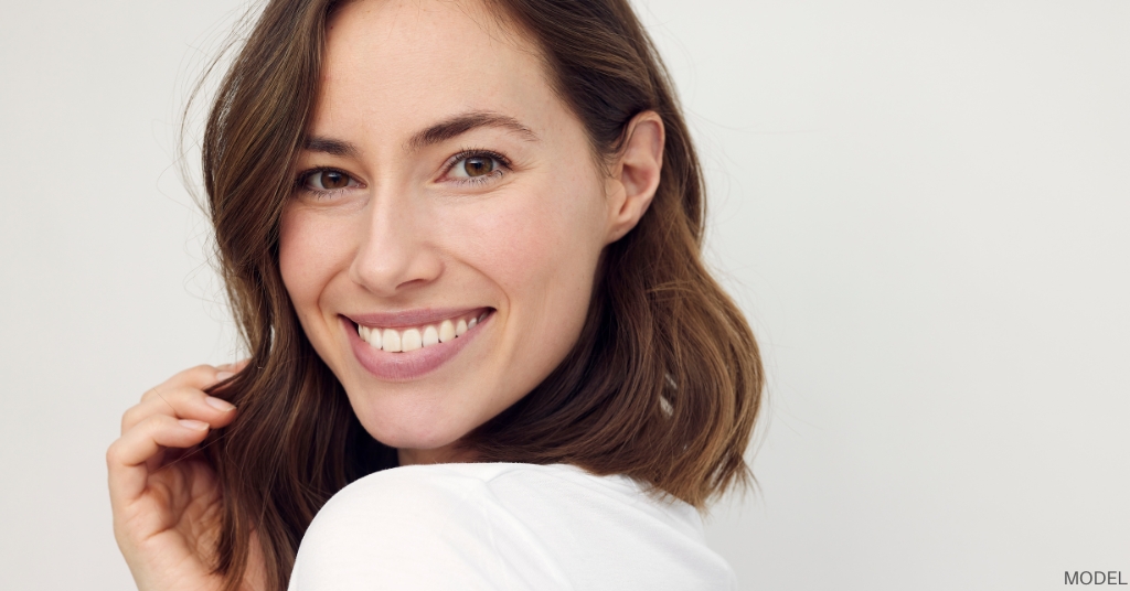 Women with brown hair and beautiful skin smiling (model)