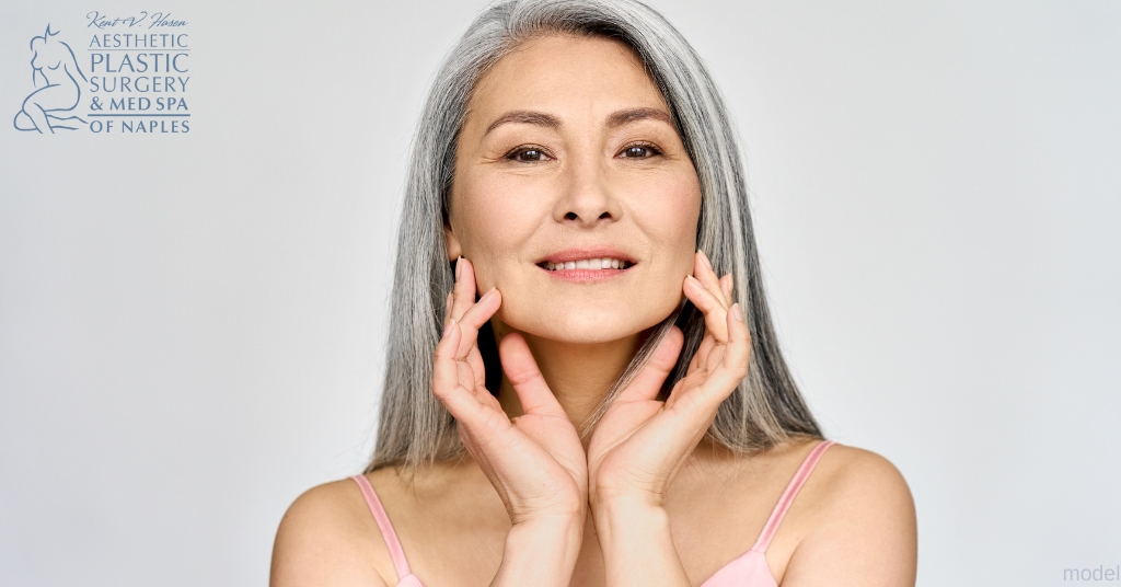 Woman in her sixties examines her tight skin from Ellacor treatment (model)