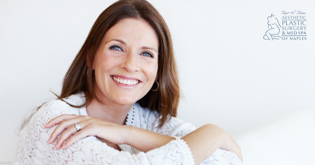 Beautiful Middle Aged Woman smiling with hands resting in her shoulders (MODEL)