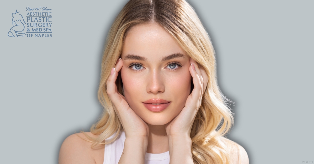 Woman with her hands touching her face (model)