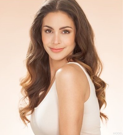 Woman in a white tank top posing for the camera (MODEL)