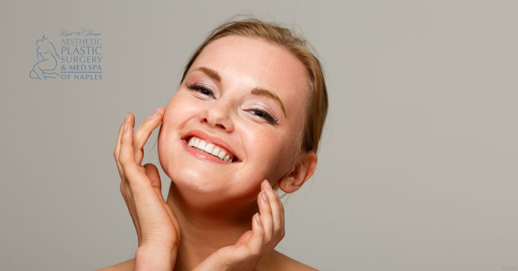 Model image of a mature woman smiling with her hands on her face