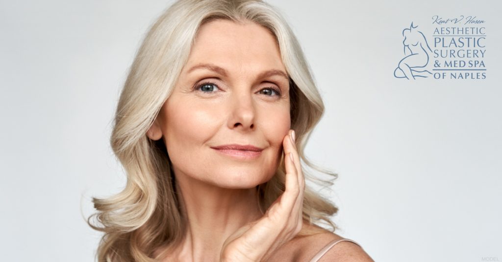 A woman with long hair posing for the camera (model) Kent V. Hasen, MD Logo